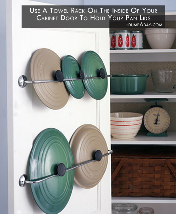 use a towel rack on the inside of your cabinet door to hold your pan lids